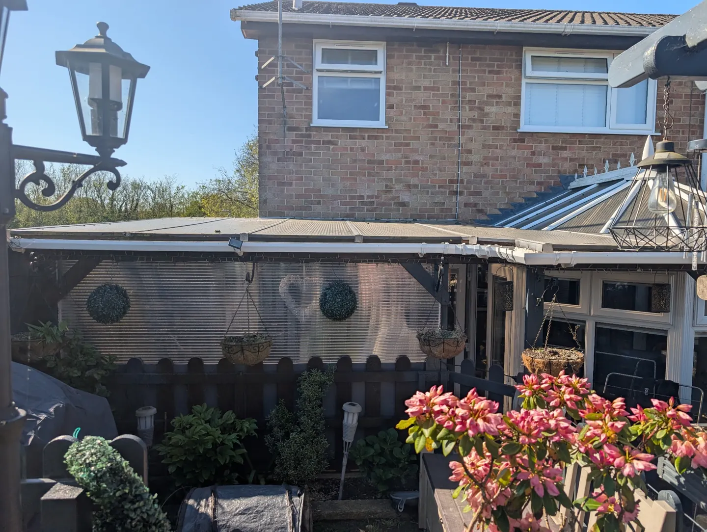 White windows, guttering and a conservatory at a client property